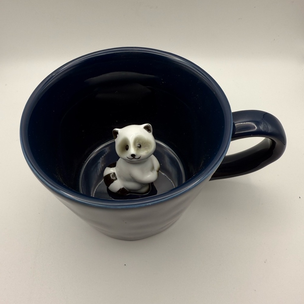 Navy Blue Mug with Baby Raccoon Inside 3”